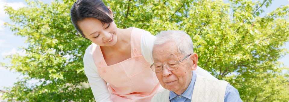 caregiver guiding senior man